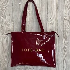 Glossy Red Tote Bag with Gold Lettering the perfect traveling bag